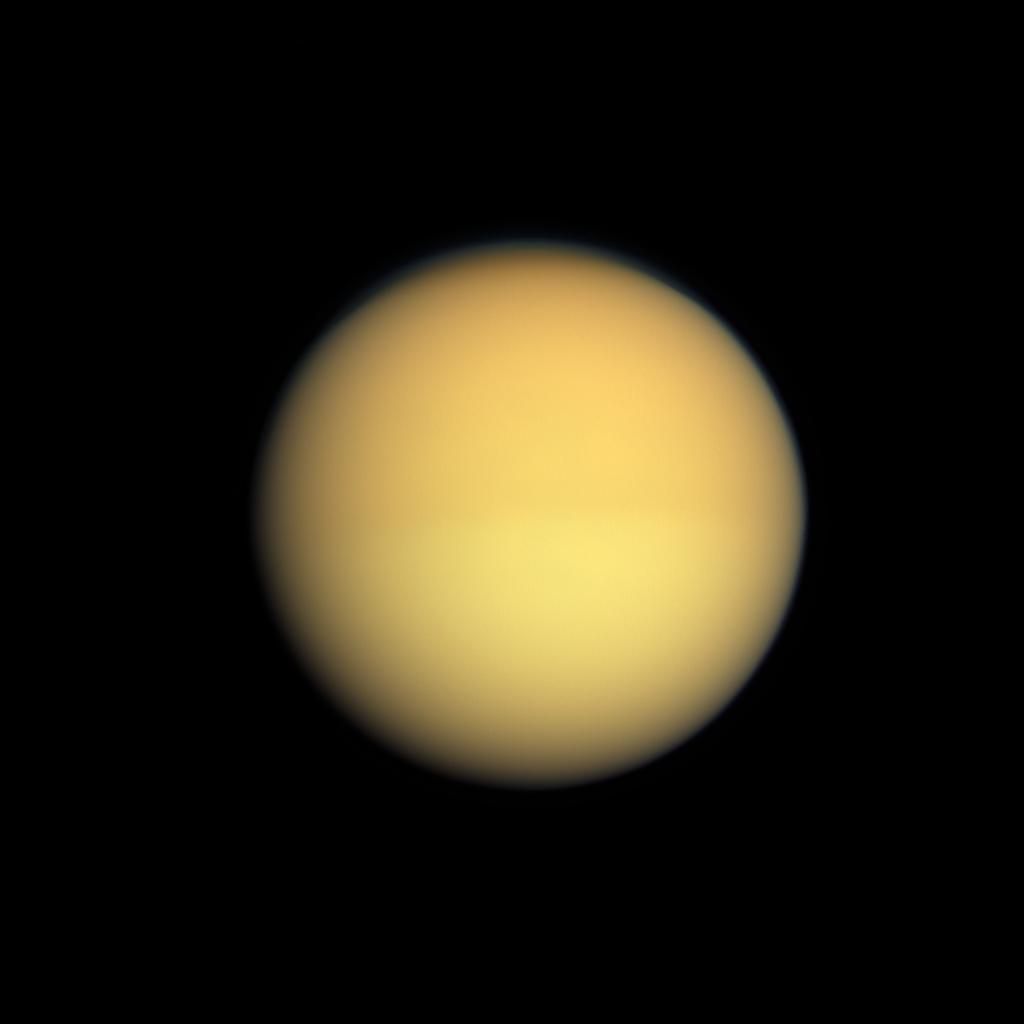 Full-disc view of Saturn's moon Titan photographed by the Cassini orbiter in 2009, showing the moon as a hazy orange sphere
